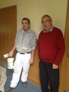 Picture of men involved in decorating the Centre