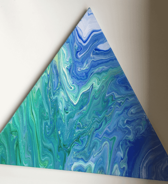 A triangular painting with blue and green swirls of colour